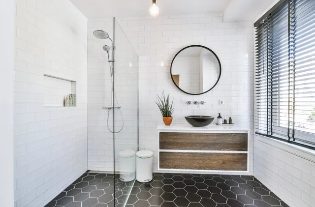 Classic bath with warm wood vanity and soaking tub