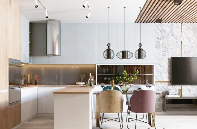 Open kitchen with light wood-look flooring continuing into the dining area