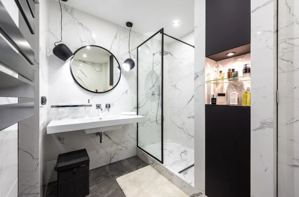 Blue tile bathroom concept with floating vanity and tub