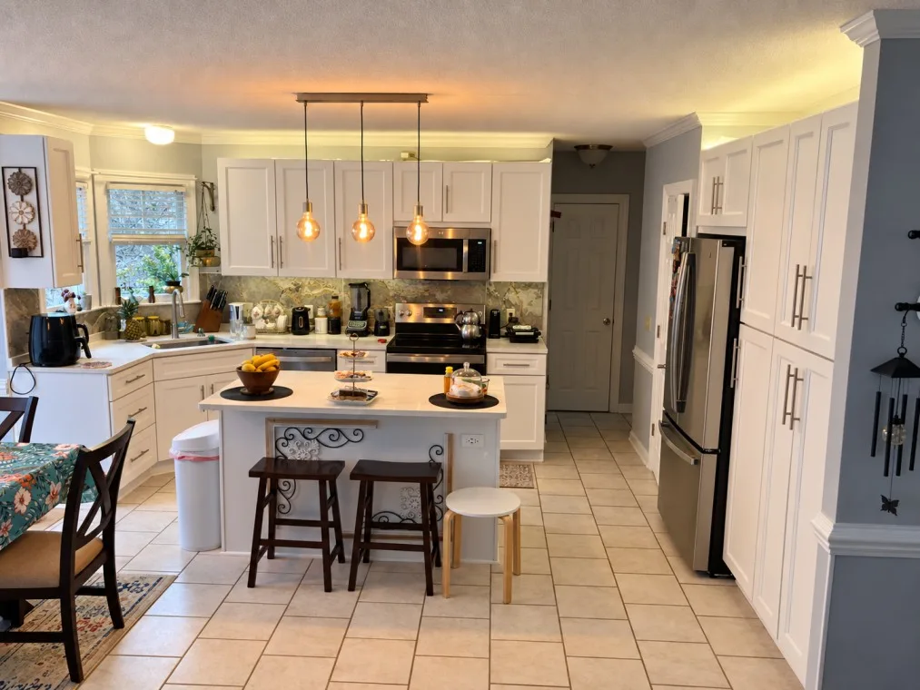 Modern kitchen island with quartz countertop and stools