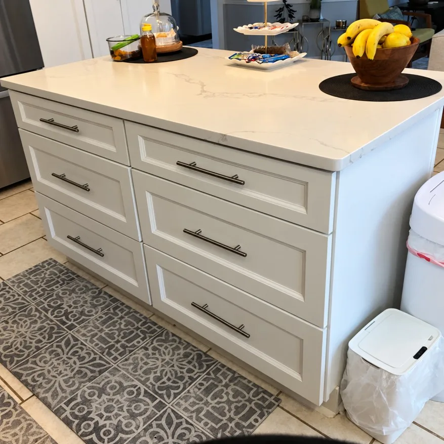 Kitchen island with shaker drawers and quartz top